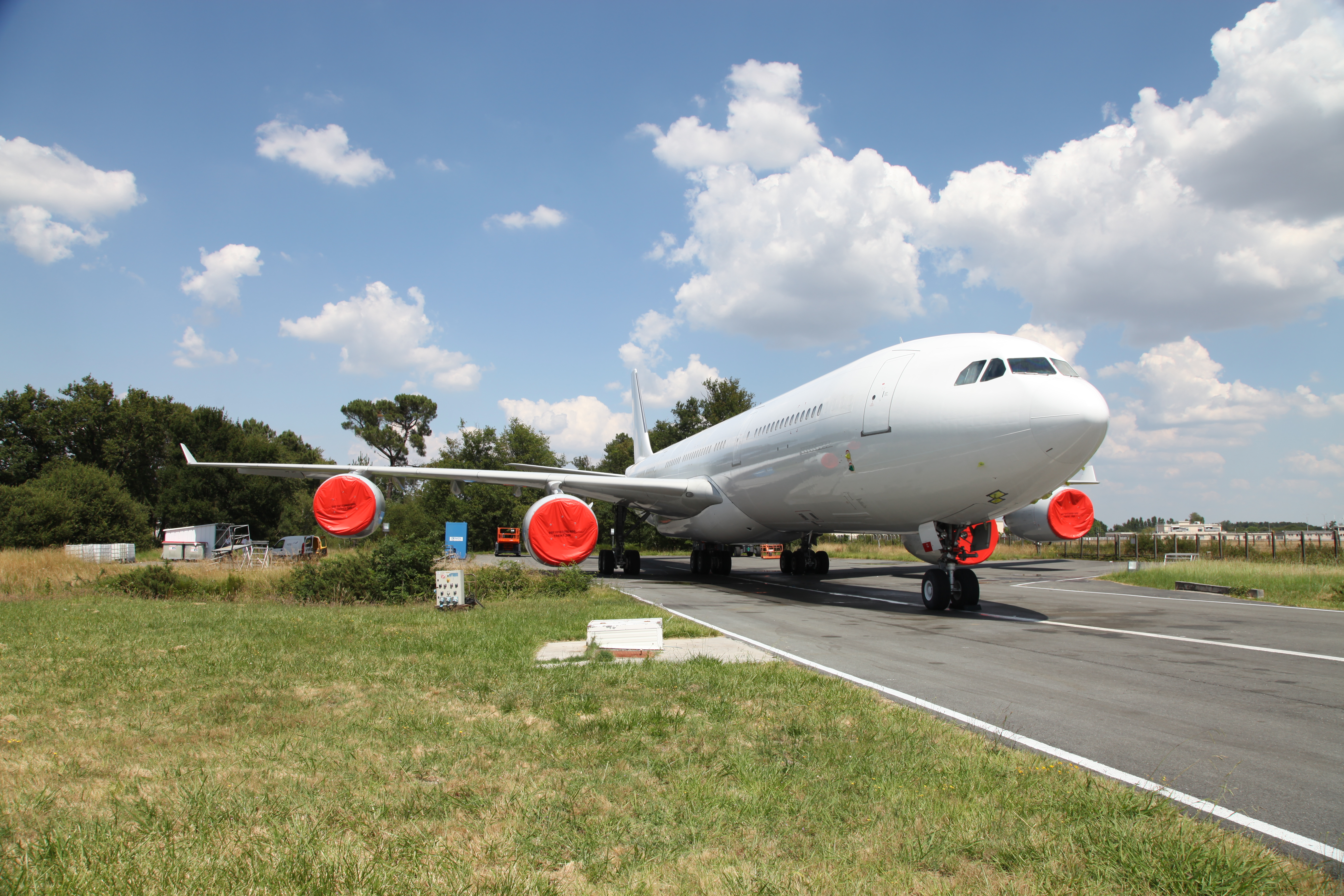 Wide-body jet aircraft at completion center — IAS Boeing BBJ Airbus ACJ private jet acquisition and pre-purchase inspection services